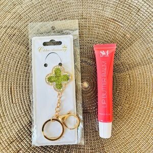 Chic Clover Keychain with  Lip Butter served to you in a glass goblet